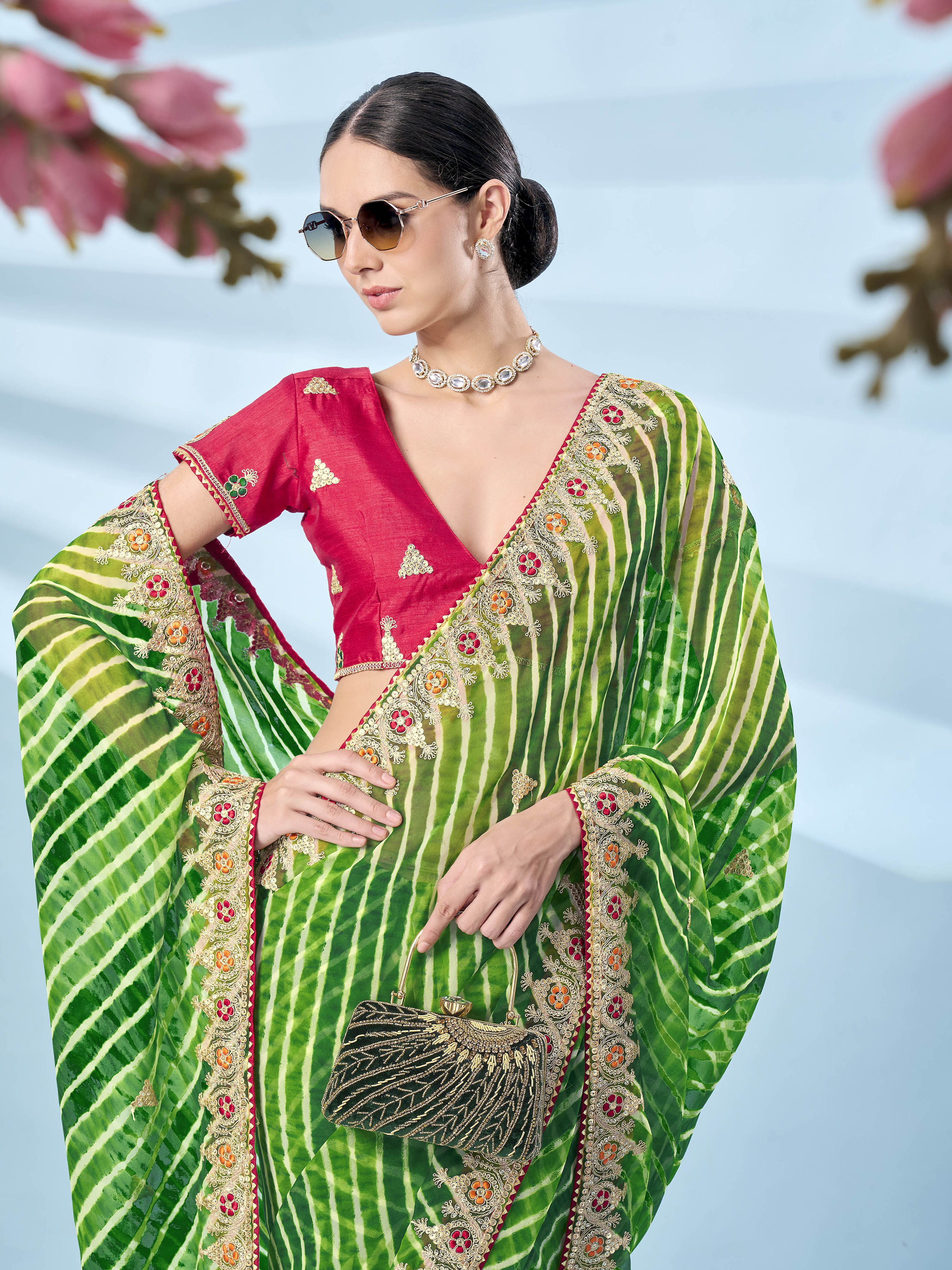Green colored leheriya printed embroidered saree